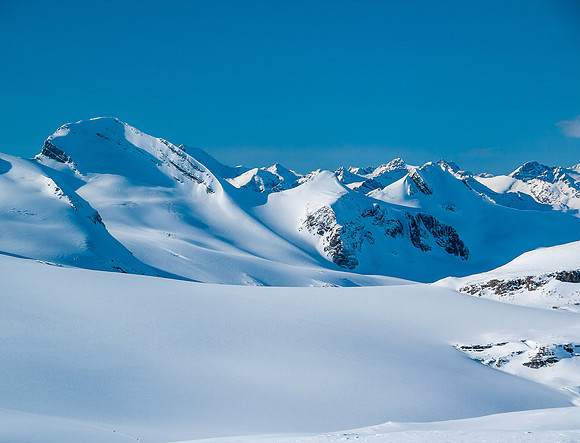 Mount Baker rises to the left (note the skiers at bottom left?) with Tilly Point at center and Trapper Peak just to its right.