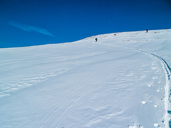 Final few meters of ascent through thin snow.
