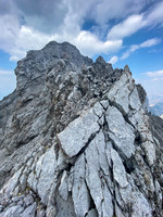 Views up the SE ridge to the summit above.