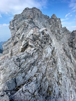 On the exposed and loose SE ridge to the summit.