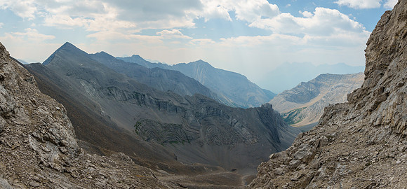 Traversing ledges back to the south face gully.