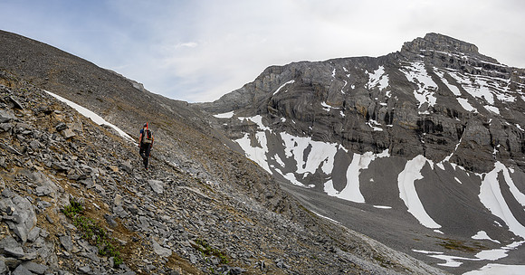 Hiking up the scree bench to the SE ridge. Solstice Peak at right.