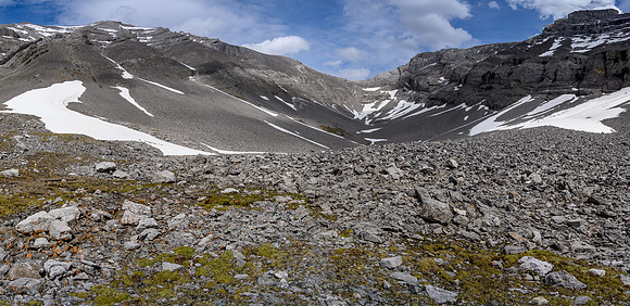 Views back up the complex terrain to the summit (L).