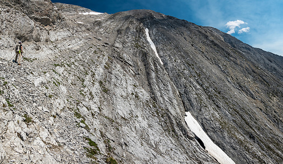 Scrambling easy to moderate ledges and rock ribs to the summit high above.