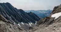 Descending slab and rubble along the sloping bench.