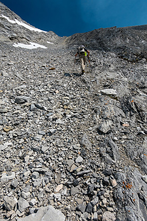 Scrambling easy to moderate ledges and rock ribs to the summit high above.