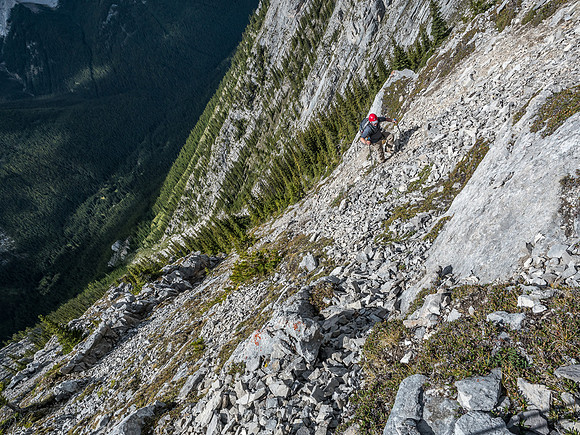 Looking down as Wietse continues traversing climber's right into another gully.