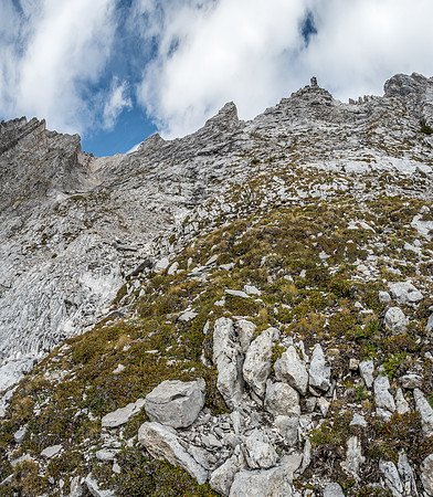 A bit further along our descent / traverse, looking up at the pinnacles and back at our descent gully, now becoming quite distant.