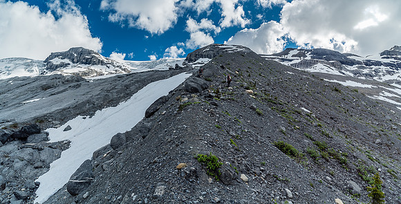 Climbing the large moraine to get above slabs on our left. This was a good move and got us onto easier snow covered terrain near two small tarns.