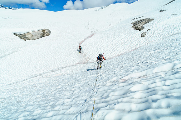 It's hard to tell if we're on snow or glacier, so we've roped up to be safe.