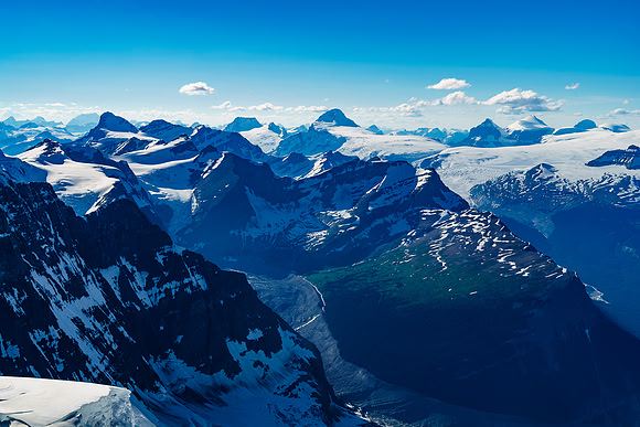 I love the deep greens on the ridge separating the headwaters of the Alexandra River at bottom left of the ridge and the Castleguard River at center to the right of it.
