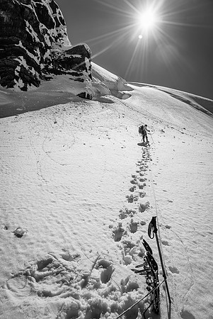 Snowshoes are off for the steep ascent ahead.