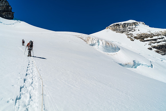 On a steeper slope to the Ernest / Edward col. The 'schrund visible just ahead of Steven here with obvious crevasses to our right.