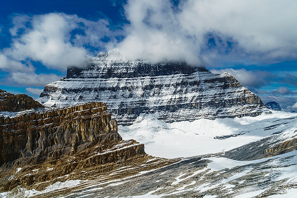 Mount Alberta looms over a tiny, insignificant Lloyd MacKay Hut and biffy.
