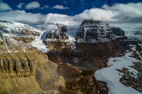 The entry to the Black Hole goes under the impressive North and West faces of the Stutfields.
