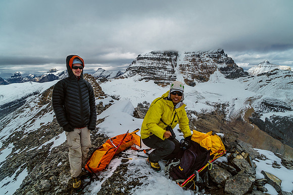 Ben and Steven on the summit of Little Alberta with Woolley and it's South Face route in the background.