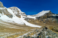 Ben comes up the moraine behind me with Mushroom Peak towering over him.