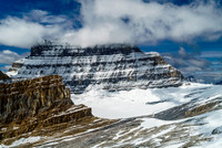 Mount Alberta looms over a tiny, insignificant Lloyd MacKay Hut and biffy.