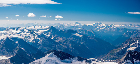Stunning views west include Mount Sir Sanford at center distance with the Adamant Range to its right.