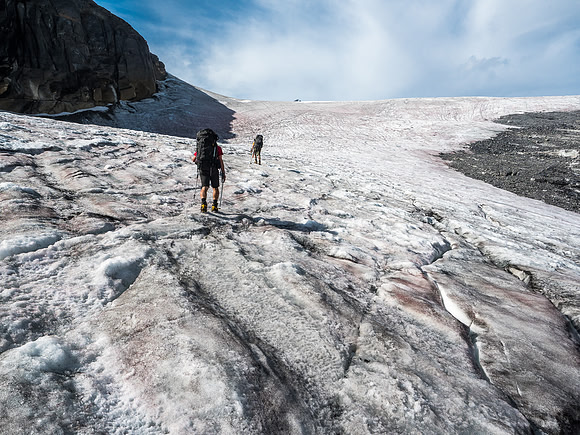 Starting up the weeping glacier beneath our bivy, which is located out of site at left here.