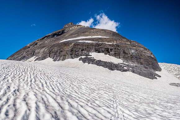 Looking back at the south face and our routes - up at L, down at R.