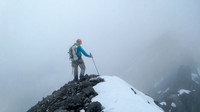 Vern climbs on in the clouds - photo by Steven Song.