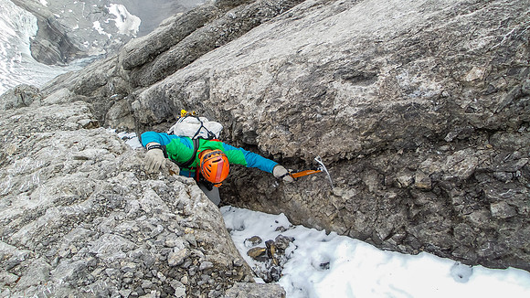 Vern climbing a gully on the ridge - note the ax that I'm using to help with the small holds on the slabs. Photo by Steven Song.