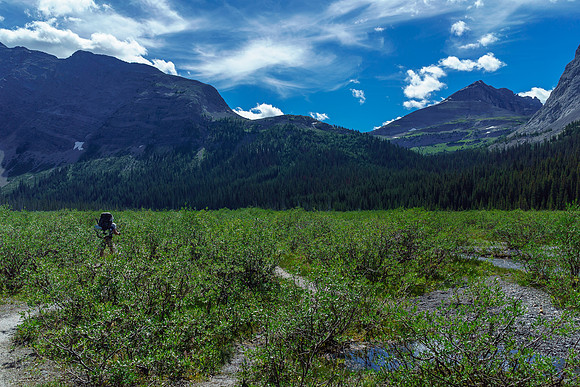 Hiking across the Burstall flats with Snow Peak rising at right.