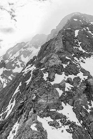 Balancing up rotten rock into the clouds.