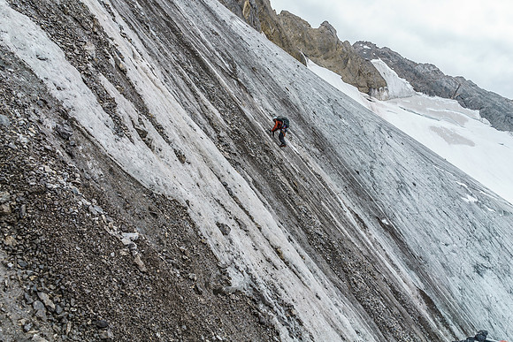 Ben descends the icy glacial tongue.