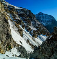 Steven and Ben come off the snow patch and up the narrow gully.