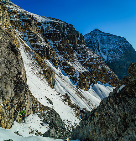 Steven and Ben come off the snow patch and up the narrow gully.