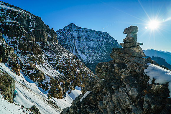 A cairn at the top of the narrow gully reassures us that we're on route. Someone's route at least!