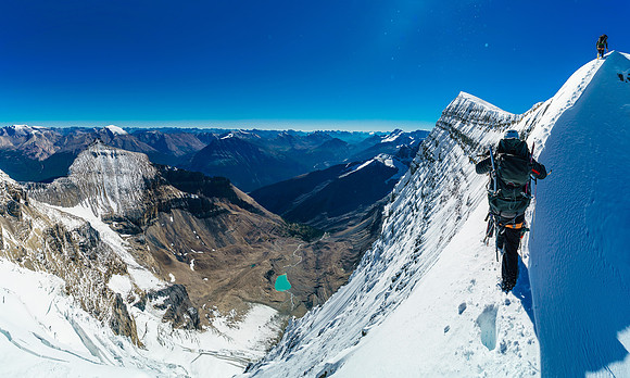 A wee bit of exposure off the snow arete looking down to the Woolley Tarn and our bivy site way below us now.