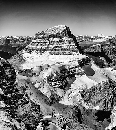 A rare view into the depths beneath Mount Alberta's NE ridge and North Face reveals a very steep glacier, plunging into another "Black Hole"