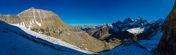 Traversing snow covered scree to the Diadem / Mushroom Glacier. Mushroom Peak towers over us now at left.