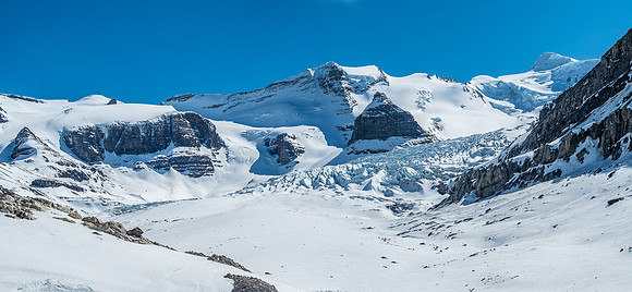 A last look back at the Robson Glacier and Resplendent (upper right). Extinguisher Tower at center.