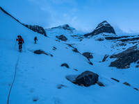 Pre-dawn light as we work our way alongside the glacier, avoiding holes and ice caves. The Extinguisher Tower at upper right.
