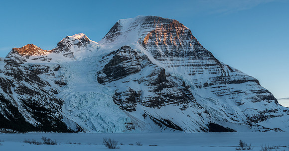 Dying light on Waffl, The Helmet and Robson from the Berg Lake shore.
