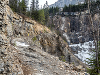 Curly Phillips was paid something like $50/mile to build the trail to Berg Lake and constructed his famous "flying trestle" somewhere near this spot