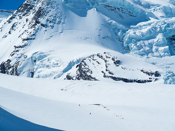 Ben and Mike ski down the final section of glacier as I watch from camp.