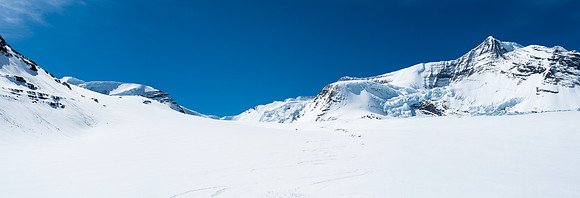 Looking back from near camp, Resplendent at far left and Ben at center, just visible in the extremely bright conditions.