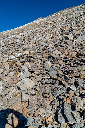 Looking up at the trudge to the summit after finally crossing numerous gullies and traversing kilometers along the base of Stewart.