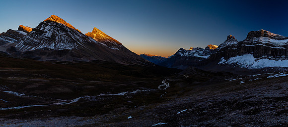 The setting sun on Stewart and its outliers as we continue back to our camp.