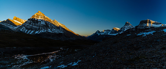 The setting sun on Stewart and its outliers as we continue back to our camp.