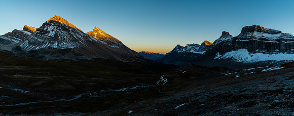 The setting sun on Stewart and its outliers as we continue back to our camp.