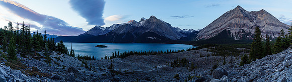 It's still fairly dark as we pass the turnoff for the Upper Kananaskis Lakes Loop trail and look back at the lake.