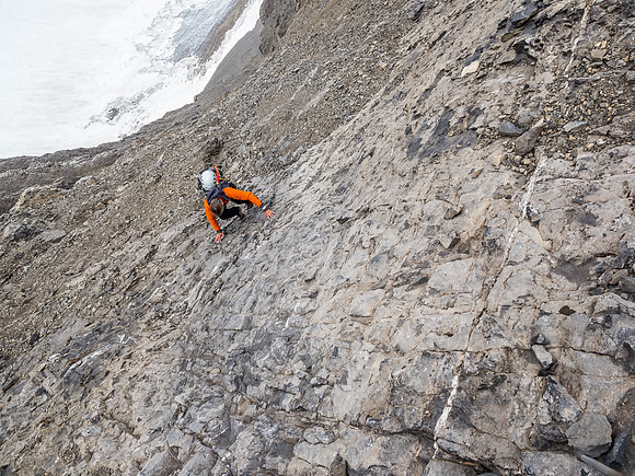 Ascending a bare section of slab in the gully. On descent we found less slabby, but steeper, terrain to skier's right of this section.