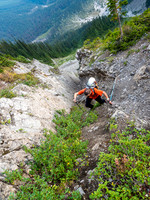 Phil tops out of the gully - the terrain is still more technical than a simple hike, thanks to a combination of loose rock, hard dirt and other Rockies gems.