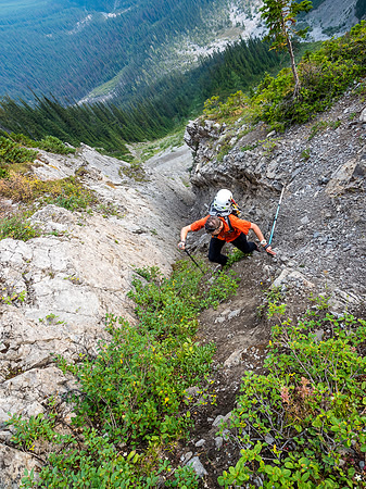 Phil tops out of the gully - the terrain is still more technical than a simple hike, thanks to a combination of loose rock, hard dirt and other Rockies gems.